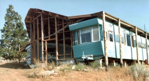 Kelly built a roof and large living room over two long single-wide travel trailers that we got for a song.